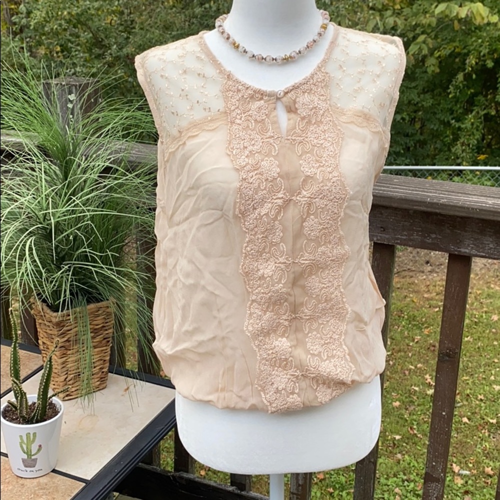 Nude sheer sleeveless shirt